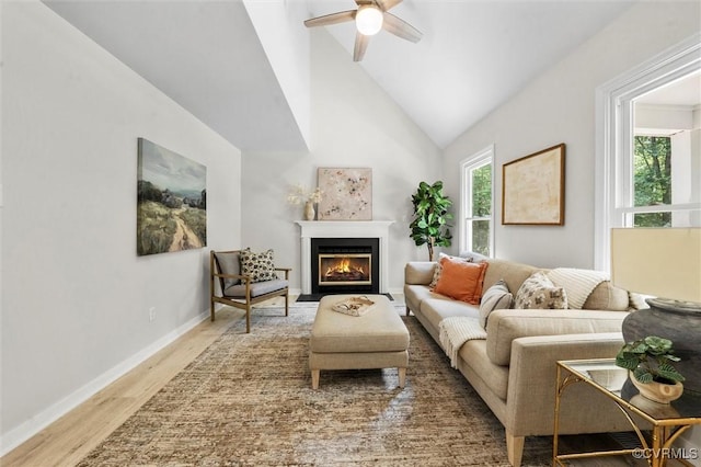 1900 Pine Creek Bluff Ct, Powhatan, VA 23139 - living area featuring wood finished floors, a ceiling fan, a fireplace with flush hearth, and vaulted ceiling