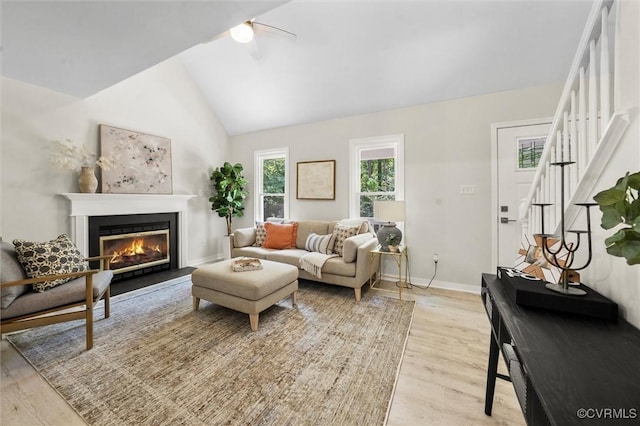 1900 Pine Creek Bluff Ct, Powhatan, VA 23139 - living room with light wood-style flooring, a glass covered fireplace, and high vaulted ceiling