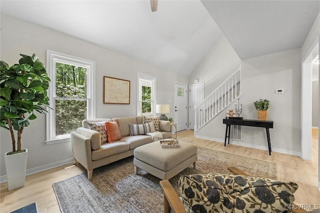1900 Pine Creek Bluff Ct, Powhatan, VA 23139 - living area featuring stairs, wood finished floors, and lofted ceiling
