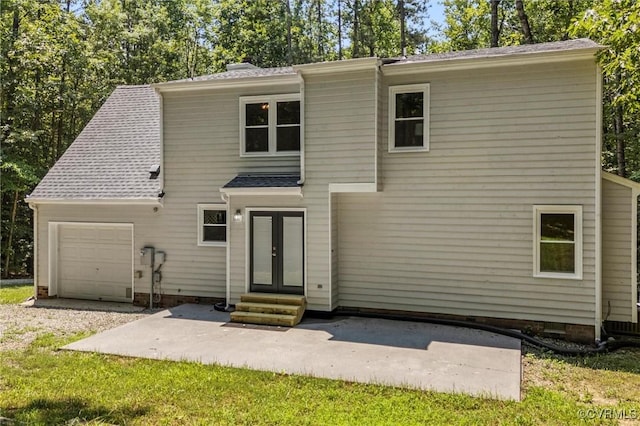 1900 Pine Creek Bluff Ct, Powhatan, VA 23139 - back of house with entry steps, an attached garage, french doors, and a patio