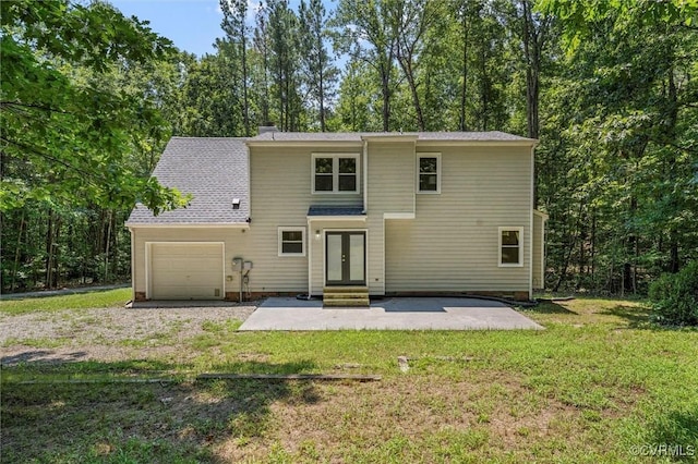1900 Pine Creek Bluff Ct, Powhatan, VA 23139 - back of property with french doors, a yard, a patio area, and gravel driveway