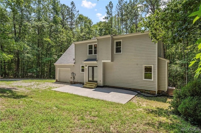 1900 Pine Creek Bluff Ct, Powhatan, VA 23139 - rear view of house with a garage, a yard, french doors, and entry steps