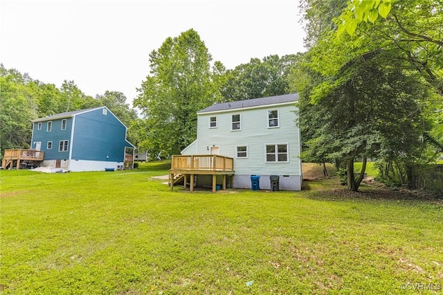 6910 Siliman Dr, Chesterfield, VA 23832 - back of property with a deck, a lawn, and view of wooded area