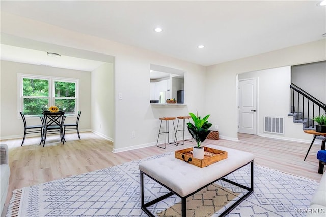 6910 Siliman Dr, Chesterfield, VA 23832 - living room featuring light wood-type flooring, stairs, and recessed lighting