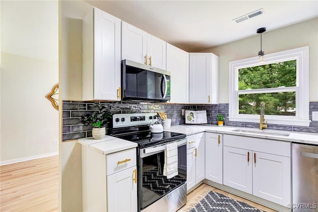 6910 Siliman Dr, Chesterfield, VA 23832 - kitchen with stainless steel appliances, light countertops, and tasteful backsplash