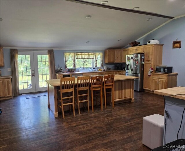 20803 Old Beaver Pond Rd, Mc Kenney, VA 23872 - kitchen featuring stainless steel fridge with ice dispenser, vaulted ceiling, dark wood-type flooring, a kitchen island, and light countertops