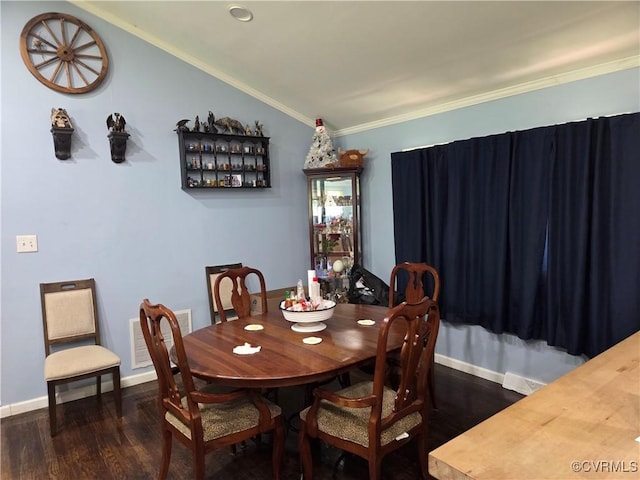 20803 Old Beaver Pond Rd, Mc Kenney, VA 23872 - dining area with dark wood-style floors, crown molding, and vaulted ceiling