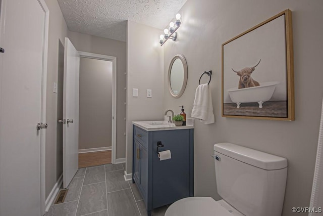 1300 Hyner Cir, Sandston, VA 23231 - bathroom featuring vanity and a textured ceiling