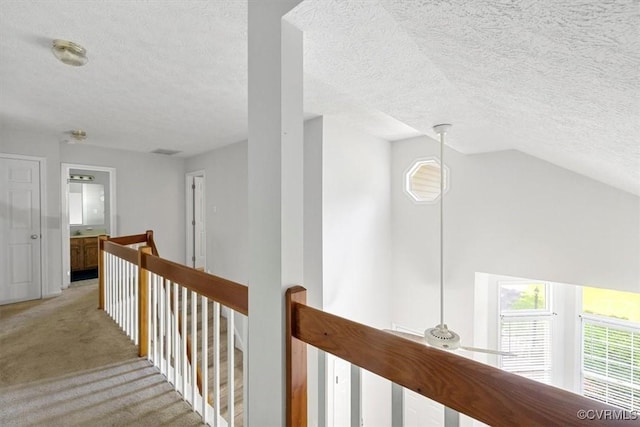 3019 Ramsey Dr, Chester, VA 23831 - hall with an upstairs landing, a textured ceiling, and light colored carpet