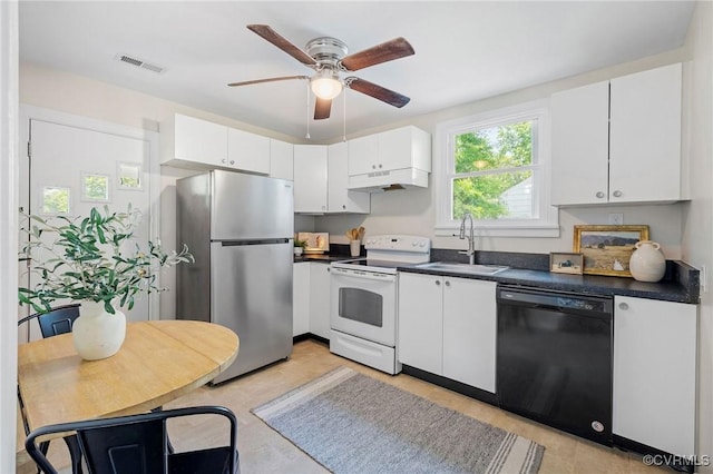 3912 Alma Ave, Henrico, VA 23222 - kitchen with dishwasher, white range with electric cooktop, freestanding refrigerator, under cabinet range hood, and dark countertops