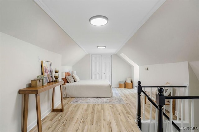 3912 Alma Ave, Henrico, VA 23222 - bedroom with wood finished floors, a closet, and vaulted ceiling
