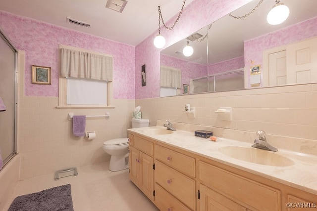 570 Three Chopt Rd, Manakin Sabot, VA 23103 - bathroom with tile walls, double vanity, tile patterned flooring, and a wainscoted wall