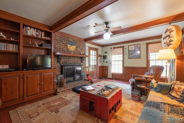 570 Three Chopt Rd, Manakin Sabot, VA 23103 - living area with ornamental molding, wainscoting, a fireplace, ceiling fan, and wood finished floors
