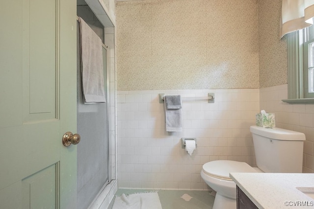 570 Three Chopt Rd, Manakin Sabot, VA 23103 - bathroom featuring vanity, tile walls, a stall shower, and a wainscoted wall