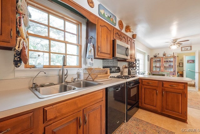 570 Three Chopt Rd, Manakin Sabot, VA 23103 - kitchen featuring black appliances, brown cabinetry, light countertops, a peninsula, and a ceiling fan