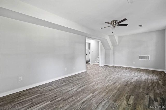 1203 Lemonwood Dr, North Prince George, VA 23860 - unfurnished room with dark wood-type flooring, ceiling fan, and stairway