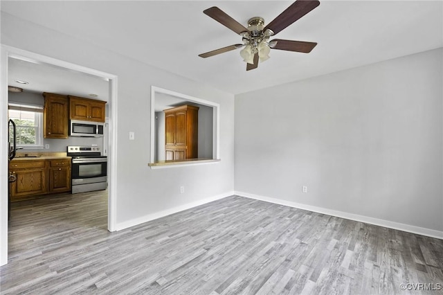 1203 Lemonwood Dr, North Prince George, VA 23860 - unfurnished living room with wood finished floors and ceiling fan