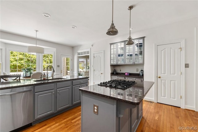 14230 Post Mill Dr, Midlothian, VA 23113 - kitchen with dishwasher, gray cabinetry, gas cooktop, a center island, and light wood-type flooring