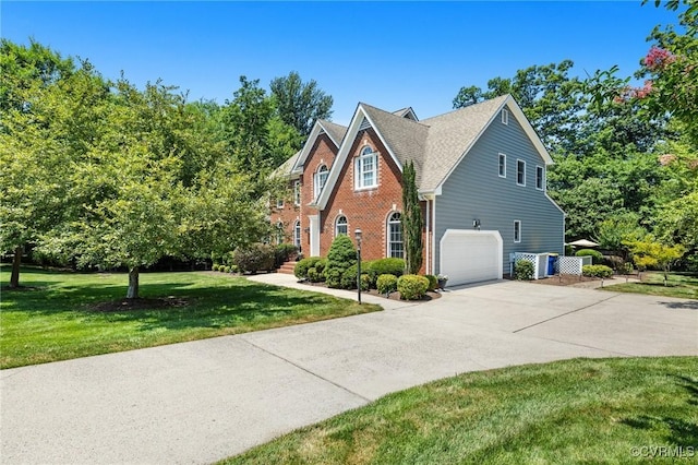 14230 Post Mill Dr, Midlothian, VA 23113 - view of property exterior featuring a garage, concrete driveway, a lawn, and brick siding