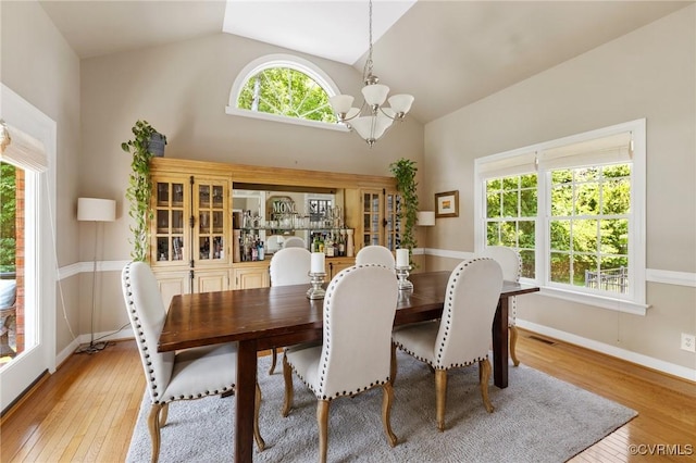 14230 Post Mill Dr, Midlothian, VA 23113 - dining room featuring a chandelier, hardwood / wood-style flooring, and high vaulted ceiling
