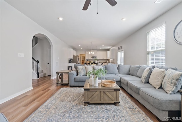 3636 Knighton Cir, Midlothian, VA 23112 - living area featuring light wood-type flooring, a ceiling fan, stairs, recessed lighting, and arched walkways