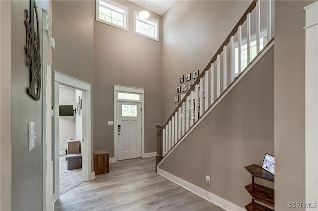 3016 Maple Grove Ln, Powhatan, VA 23139 - foyer with stairway, plenty of natural light, a high ceiling, and wood finished floors