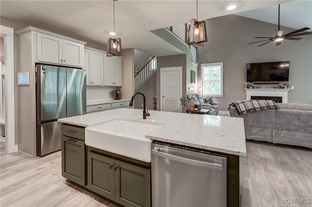 3016 Maple Grove Ln, Powhatan, VA 23139 - kitchen featuring stainless steel appliances, open floor plan, light wood finished floors, and recessed lighting