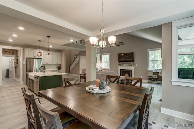 3016 Maple Grove Ln, Powhatan, VA 23139 - dining room featuring stairway, a fireplace, light wood-type flooring, healthy amount of natural light, and recessed lighting