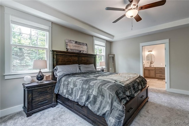 3016 Maple Grove Ln, Powhatan, VA 23139 - bedroom featuring light colored carpet, a tray ceiling, ensuite bath, and a ceiling fan
