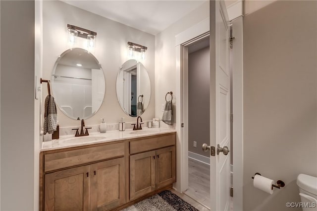 3016 Maple Grove Ln, Powhatan, VA 23139 - full bathroom featuring double vanity and wood finished floors