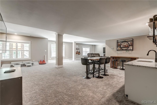 3016 Maple Grove Ln, Powhatan, VA 23139 - carpeted living area featuring decorative columns and bar