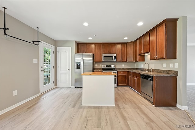 3036 Perdue Springs Ln, Chester, VA 23831 - kitchen featuring appliances with stainless steel finishes, light wood finished floors, a kitchen island, recessed lighting, and butcher block countertops