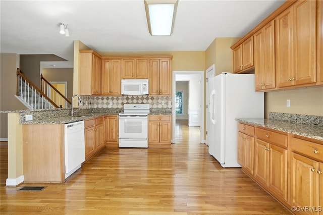 8248 Hampton Arbor Cir, Chesterfield, VA 23832 - kitchen with white appliances, light wood-style floors, light stone counters, and decorative backsplash