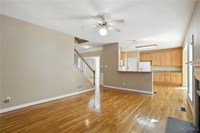8248 Hampton Arbor Cir, Chesterfield, VA 23832 - unfurnished living room with a ceiling fan, light wood-style flooring, stairs, a fireplace, and ornamental molding