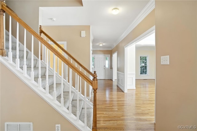 8248 Hampton Arbor Cir, Chesterfield, VA 23832 - entrance foyer with crown molding, light wood finished floors, stairway, a decorative wall, and wainscoting