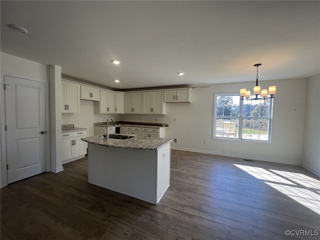 4917 Bailey Woods Ln, Midlothian, VA 23112 - kitchen featuring a chandelier, dark wood-type flooring, a kitchen island with sink, white cabinets, and light stone countertops