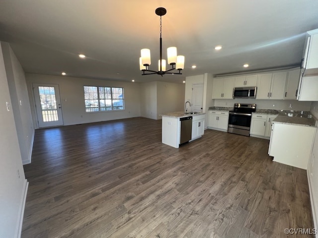 4917 Bailey Woods Ln, Midlothian, VA 23112 - kitchen with appliances with stainless steel finishes, open floor plan, a chandelier, dark wood-style floors, and white cabinetry