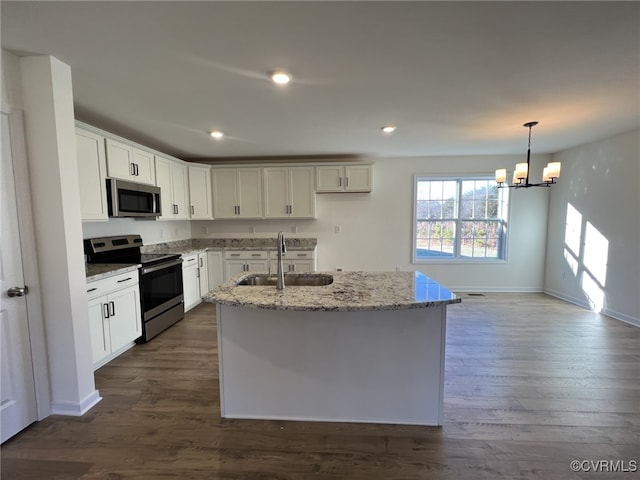 4917 Bailey Woods Ln, Midlothian, VA 23112 - kitchen with stainless steel appliances, light stone countertops, a chandelier, dark wood finished floors, and recessed lighting