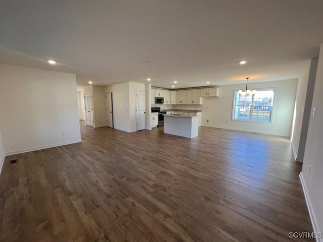 4917 Bailey Woods Ln, Midlothian, VA 23112 - unfurnished living room with a chandelier, recessed lighting, and dark wood-style floors
