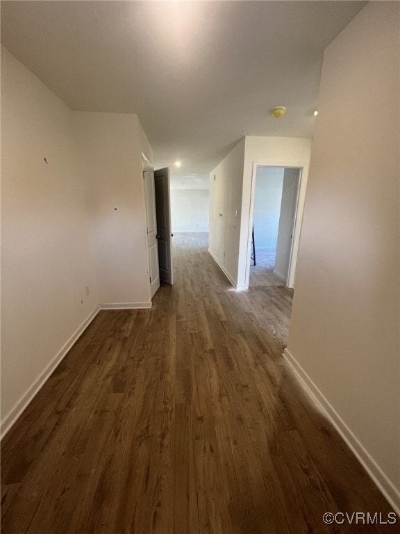 4917 Bailey Woods Ln, Midlothian, VA 23112 - hallway with dark wood-style floors and baseboards