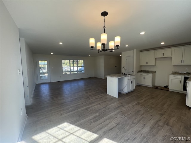 4917 Bailey Woods Ln, Midlothian, VA 23112 - kitchen with a chandelier, open floor plan, white cabinets, wood finished floors, and a kitchen island with sink