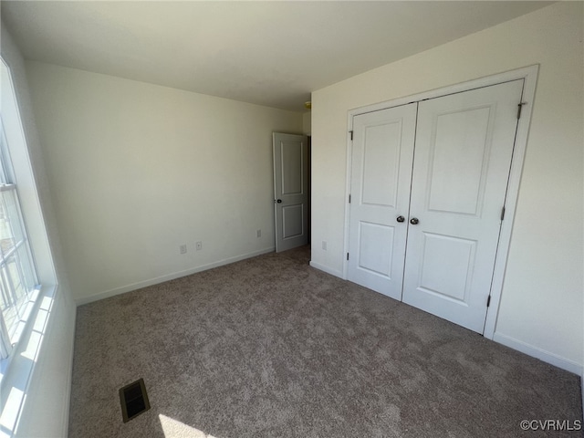 4917 Bailey Woods Ln, Midlothian, VA 23112 - unfurnished bedroom featuring carpet flooring and a closet