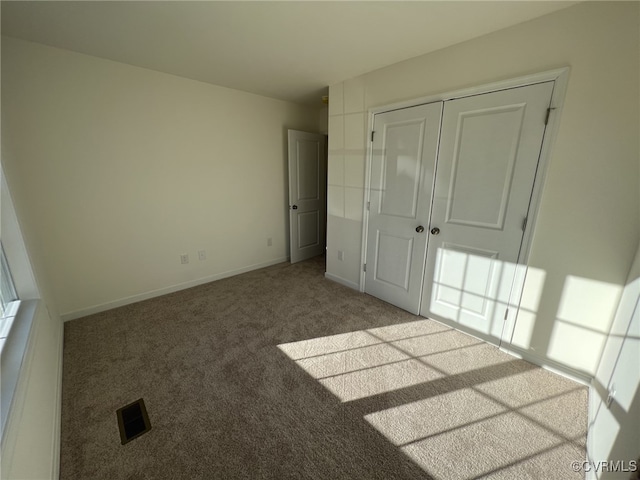 4917 Bailey Woods Ln, Midlothian, VA 23112 - unfurnished bedroom with carpet flooring and a closet