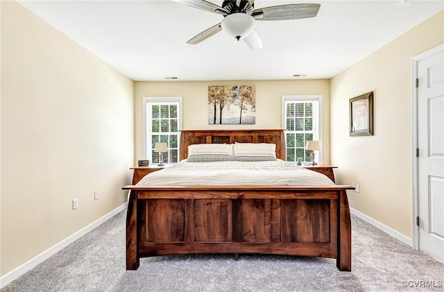5773 S Jessup Rd, Chesterfield, VA 23832 - bedroom with light carpet, multiple windows, and a ceiling fan
