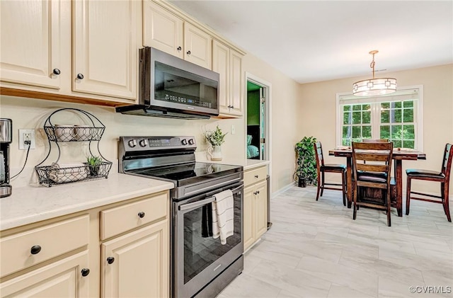 5773 S Jessup Rd, Chesterfield, VA 23832 - kitchen with stainless steel appliances, cream cabinets, light countertops, hanging light fixtures, and light marble finish floors