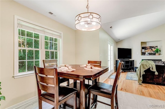 5773 S Jessup Rd, Chesterfield, VA 23832 - dining area featuring healthy amount of natural light, a chandelier, and vaulted ceiling