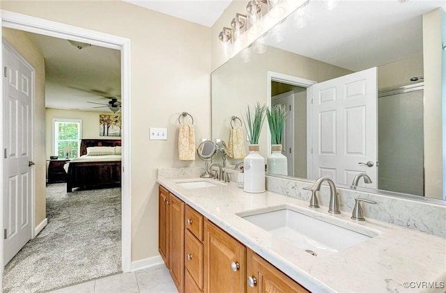 5773 S Jessup Rd, Chesterfield, VA 23832 - bathroom featuring connected bathroom, double vanity, a ceiling fan, tile patterned flooring, and a shower with door