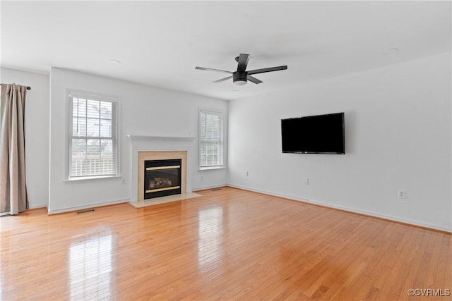 5413 Cranston Ct, Henrico, VA 23059 - unfurnished living room with ceiling fan, a fireplace with flush hearth, and light wood-style floors