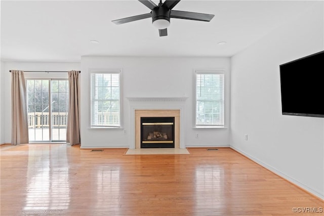 5413 Cranston Ct, Henrico, VA 23059 - unfurnished living room with wood finished floors, plenty of natural light, and a fireplace with flush hearth