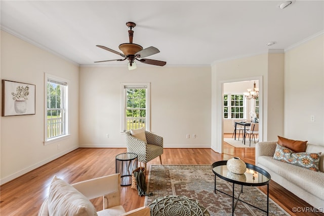 6125 Trinity Church Rd, Dinwiddie, VA 23833 - living area featuring ornamental molding, a chandelier, wood finished floors, and ceiling fan